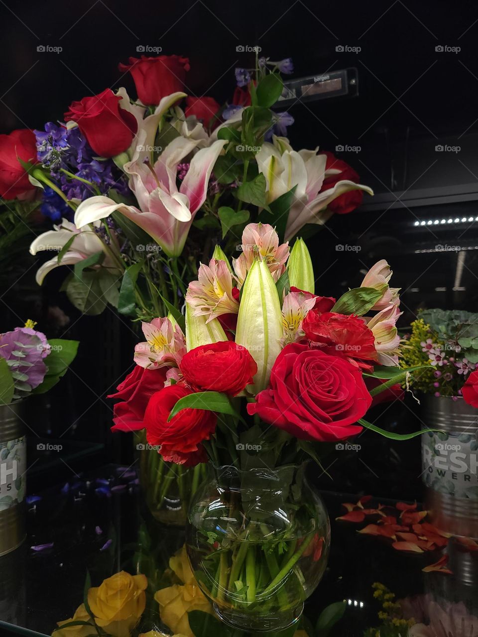 Beautiful spring flowers in various vases and vessels celebrating spring and Easter, with tulips, roses and the like