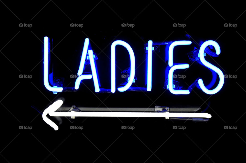 Neon ladies restroom sign.