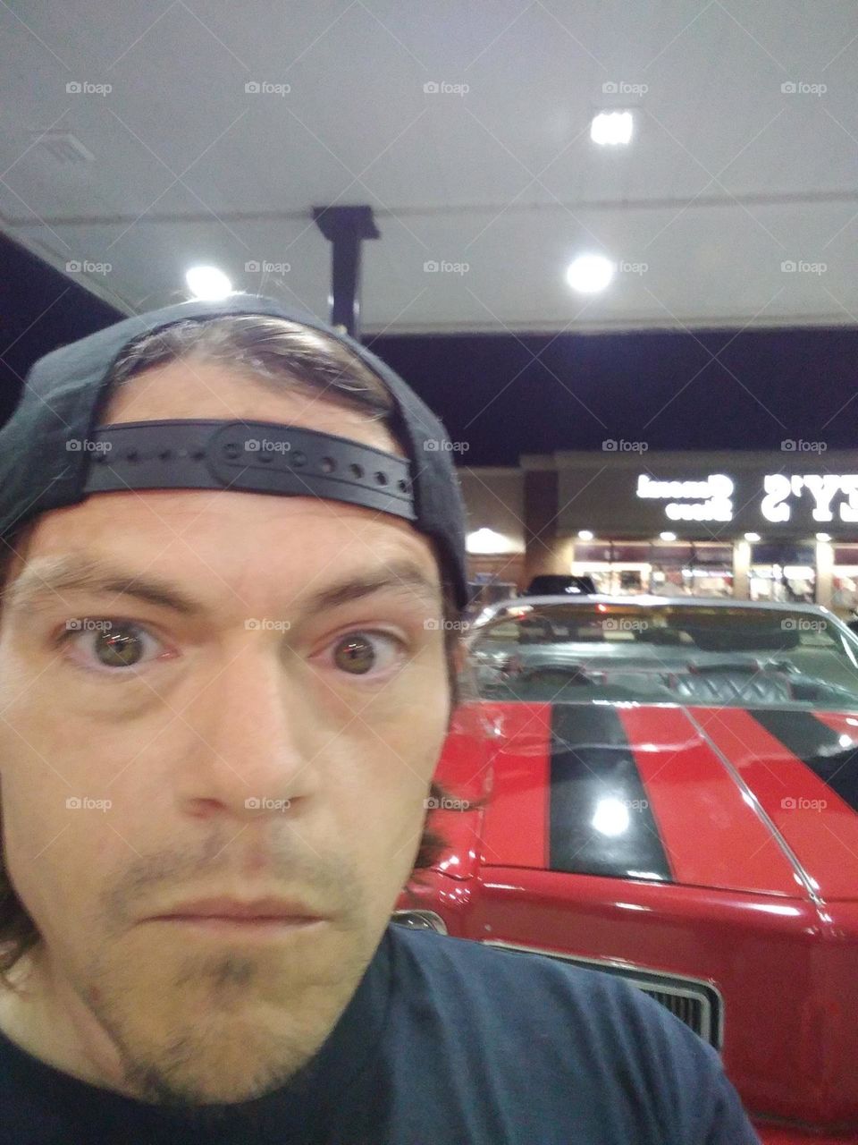 hot guy with red car
old fashioned muscle car and hot guy
cute man with red car
red car hot man gas station
