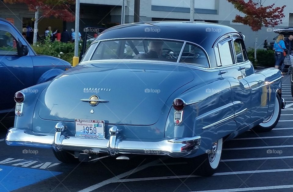 1050s car driven by an elder