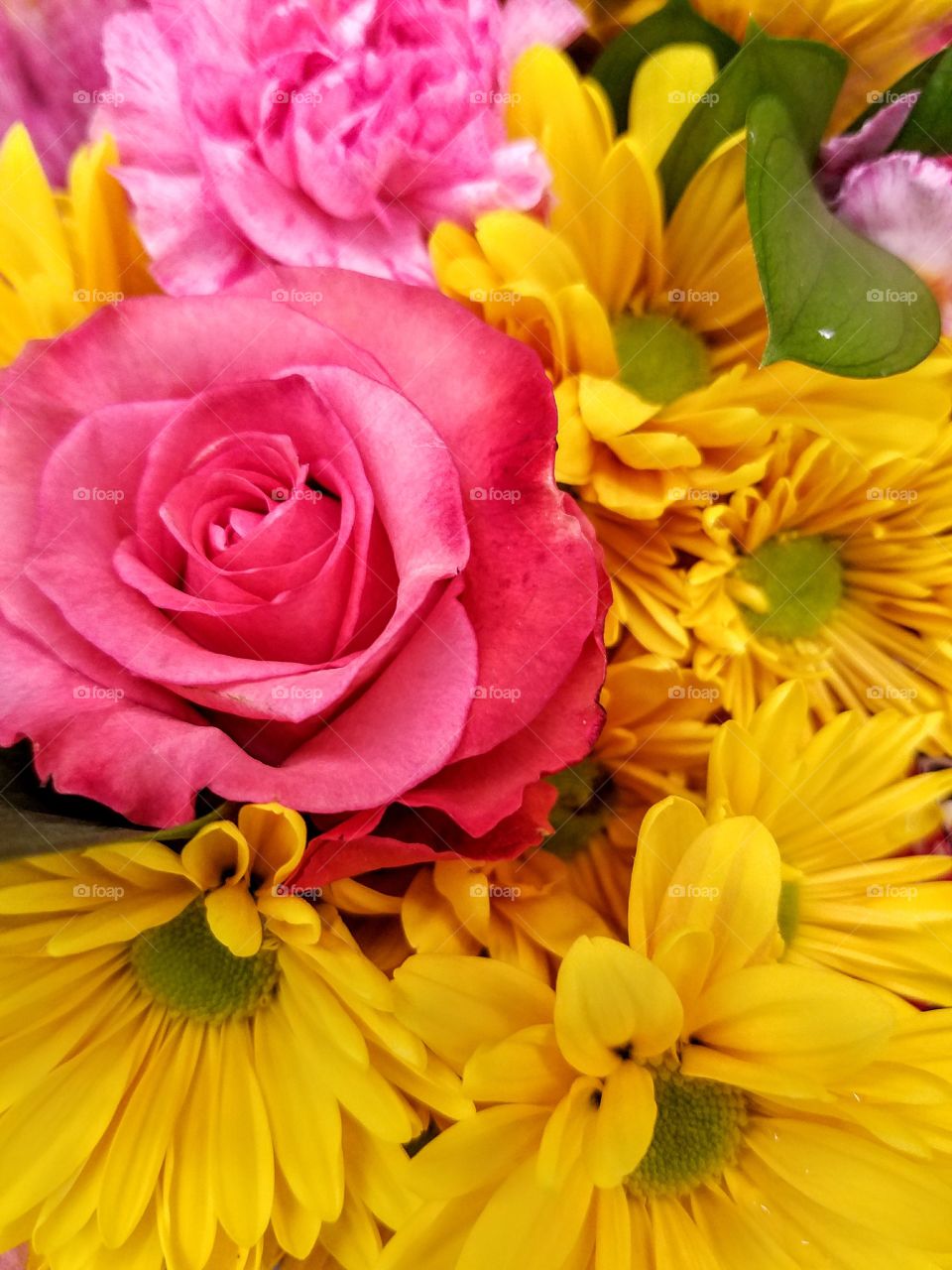 Pink rose and yellow flowers bouquet
