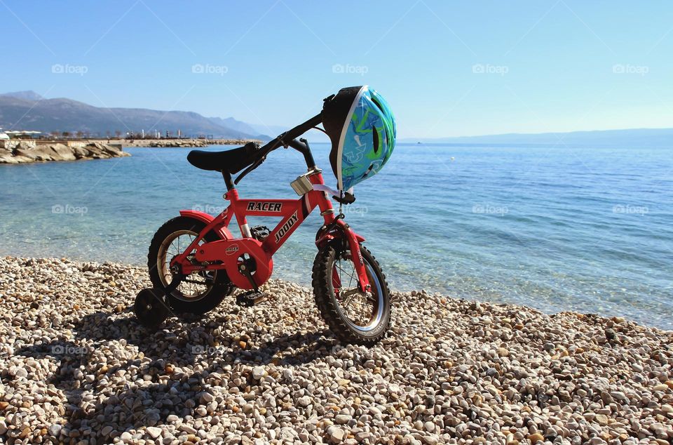 A little kid bicycle on a beach