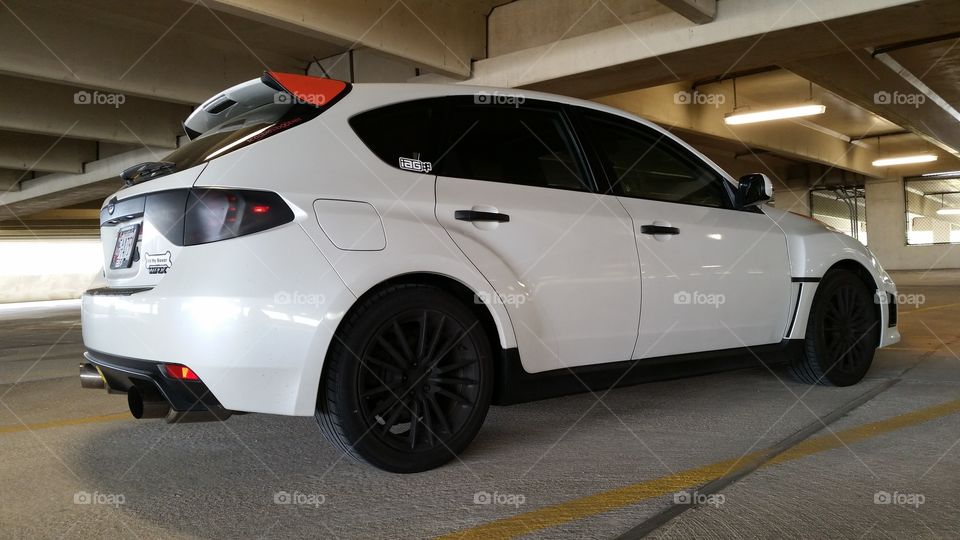 My baby. picture of my Subaru WRX in a random garage