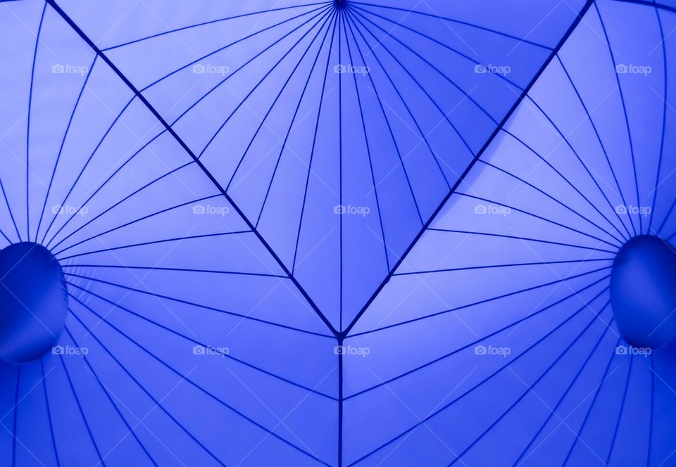 Blue triangles in an inflatable sculpture of light & air called the Luminarium 