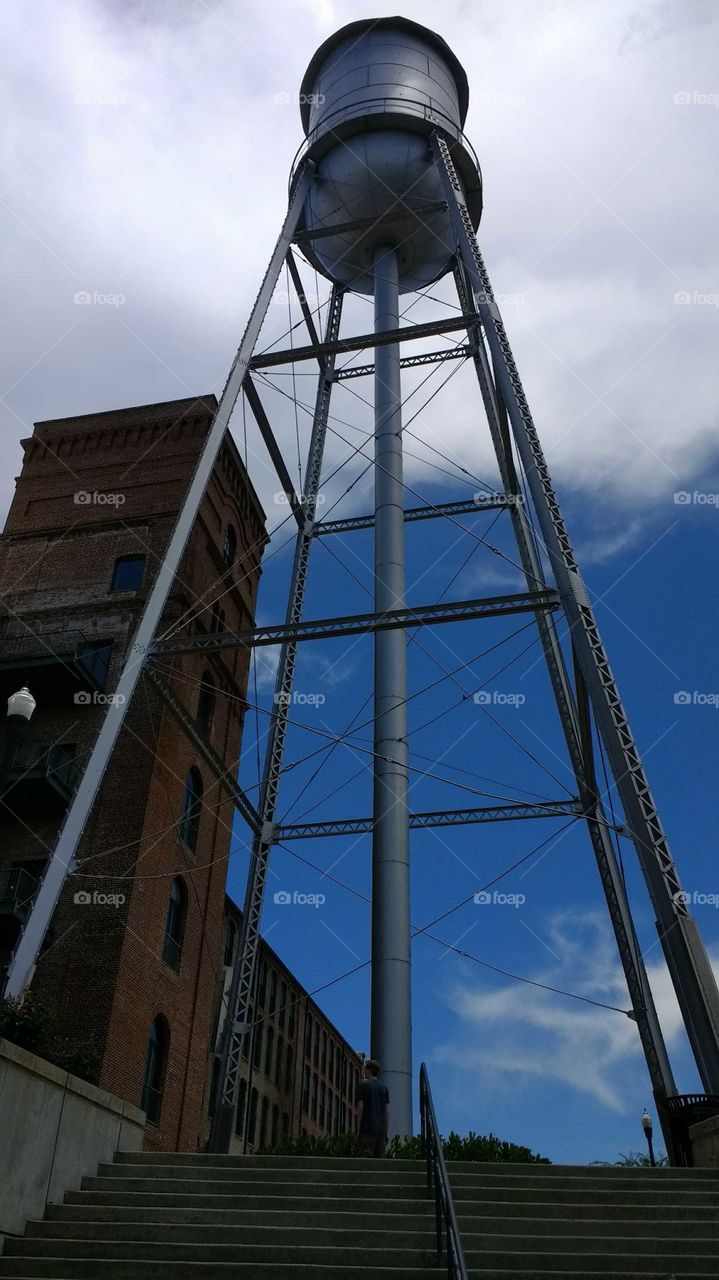 Water tower with blue skies