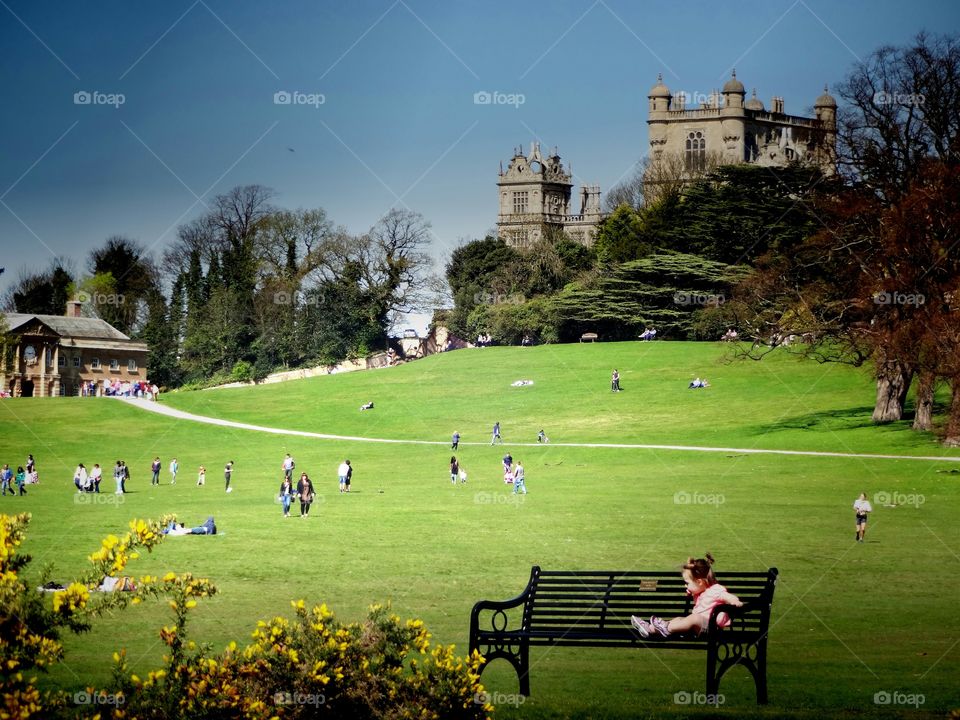 cathedral and his 203 hectares all around. people enjoying spring in Wollaton Hall and Park comprising  about 203 hectares
