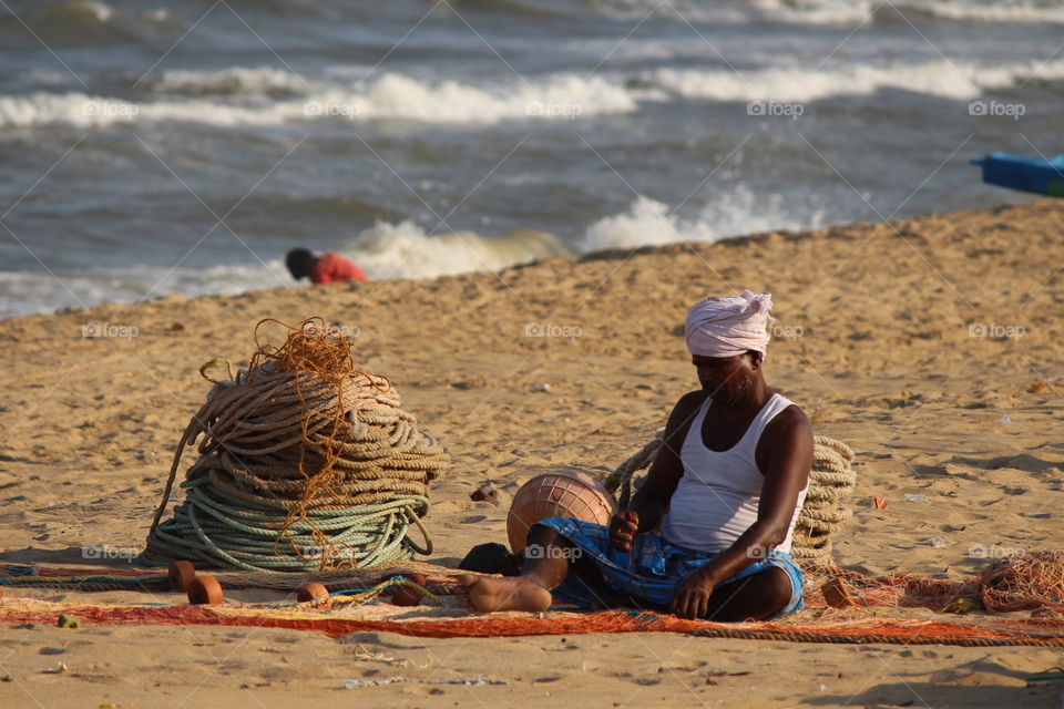 fisherman preparing his net