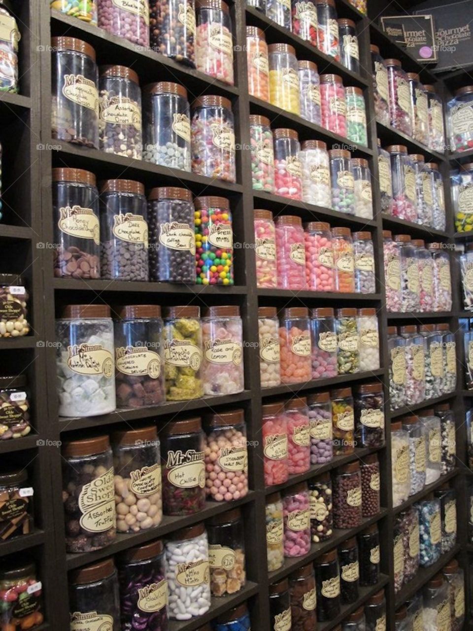 Colourful candy jars on displace in a candy shop. 
