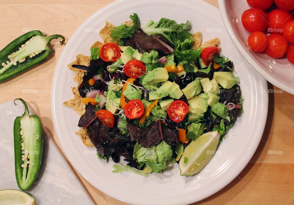 Fresh garden salad with tomatoes and avocados.