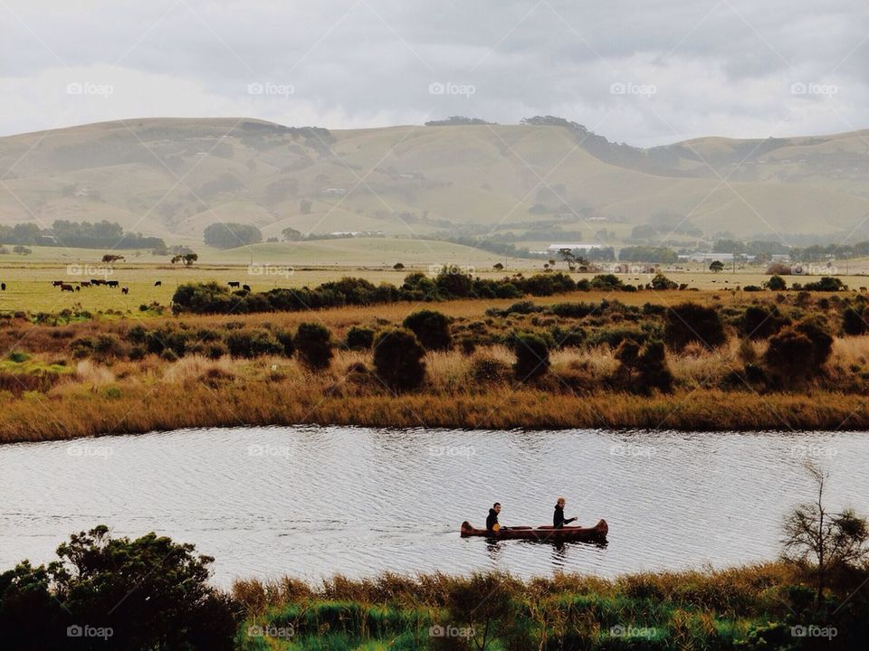 Rowers on a river