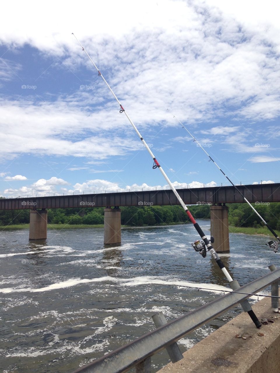 Let's go fishing . Fishing poles at the river