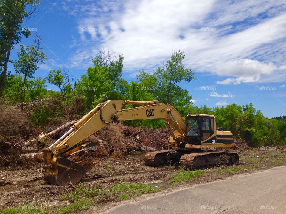 Machine at rest. Construction vehicle sitting on side of road