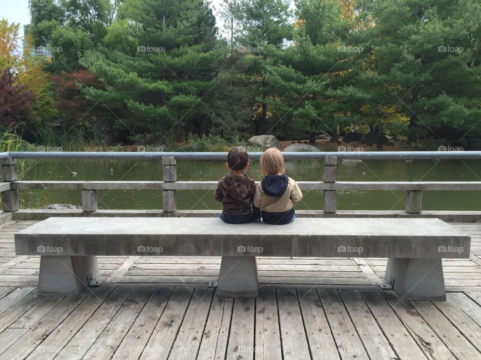 Toddlers on a bench
