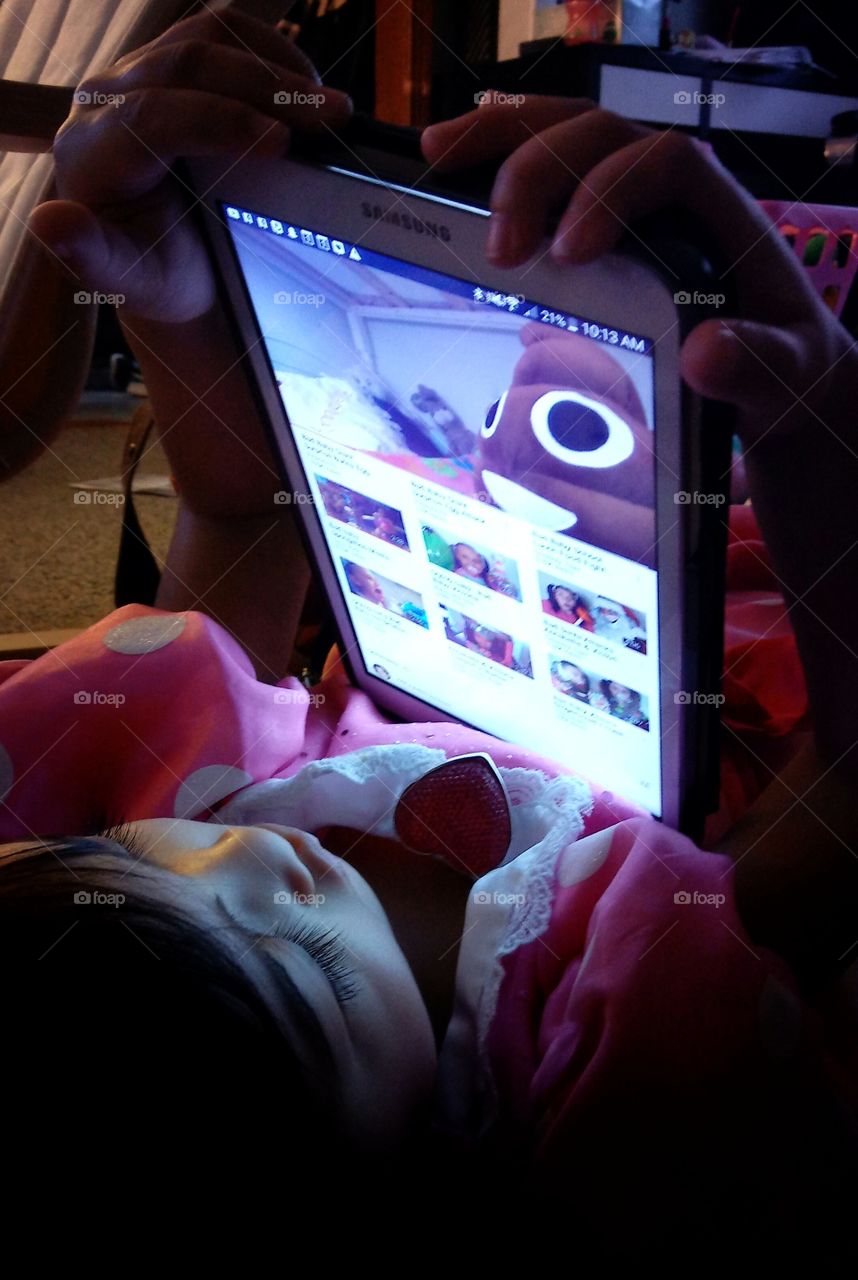 Young child watching youtube on tablet