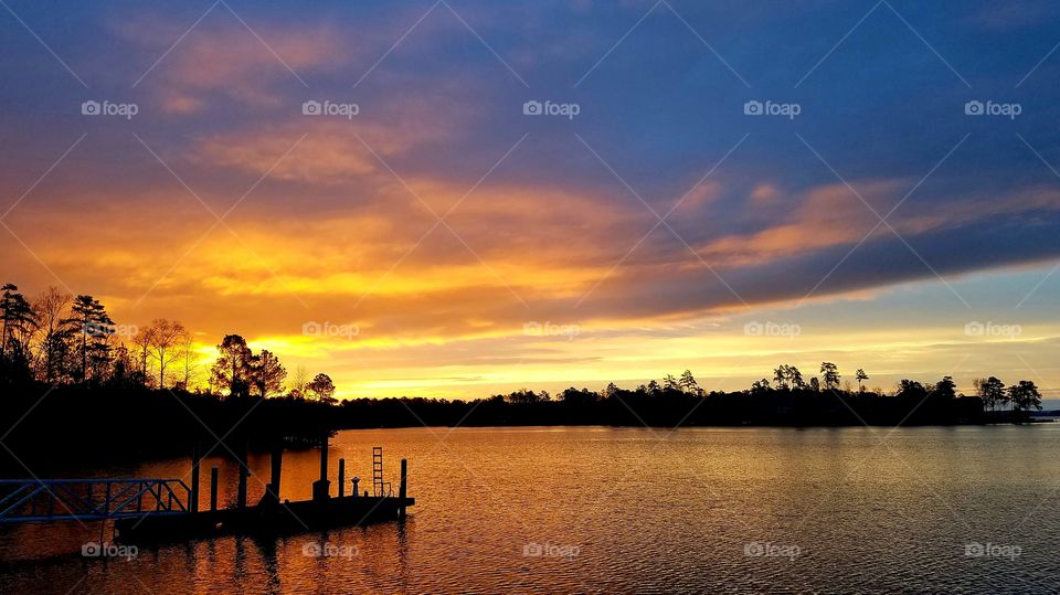 orange-purple sunrise on the lake