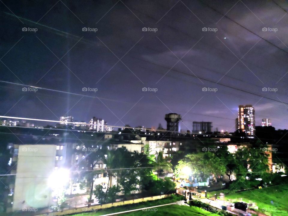 Pleasent Cloudy Sky☁️
Illumination Of Lights💡
Zenith Of Building🏢
Green Vegetation of Park