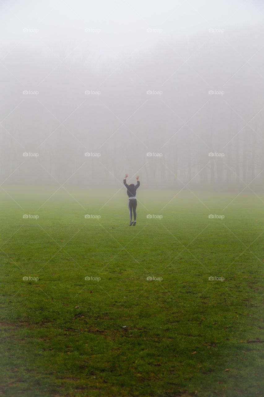 Person in foggy landscape