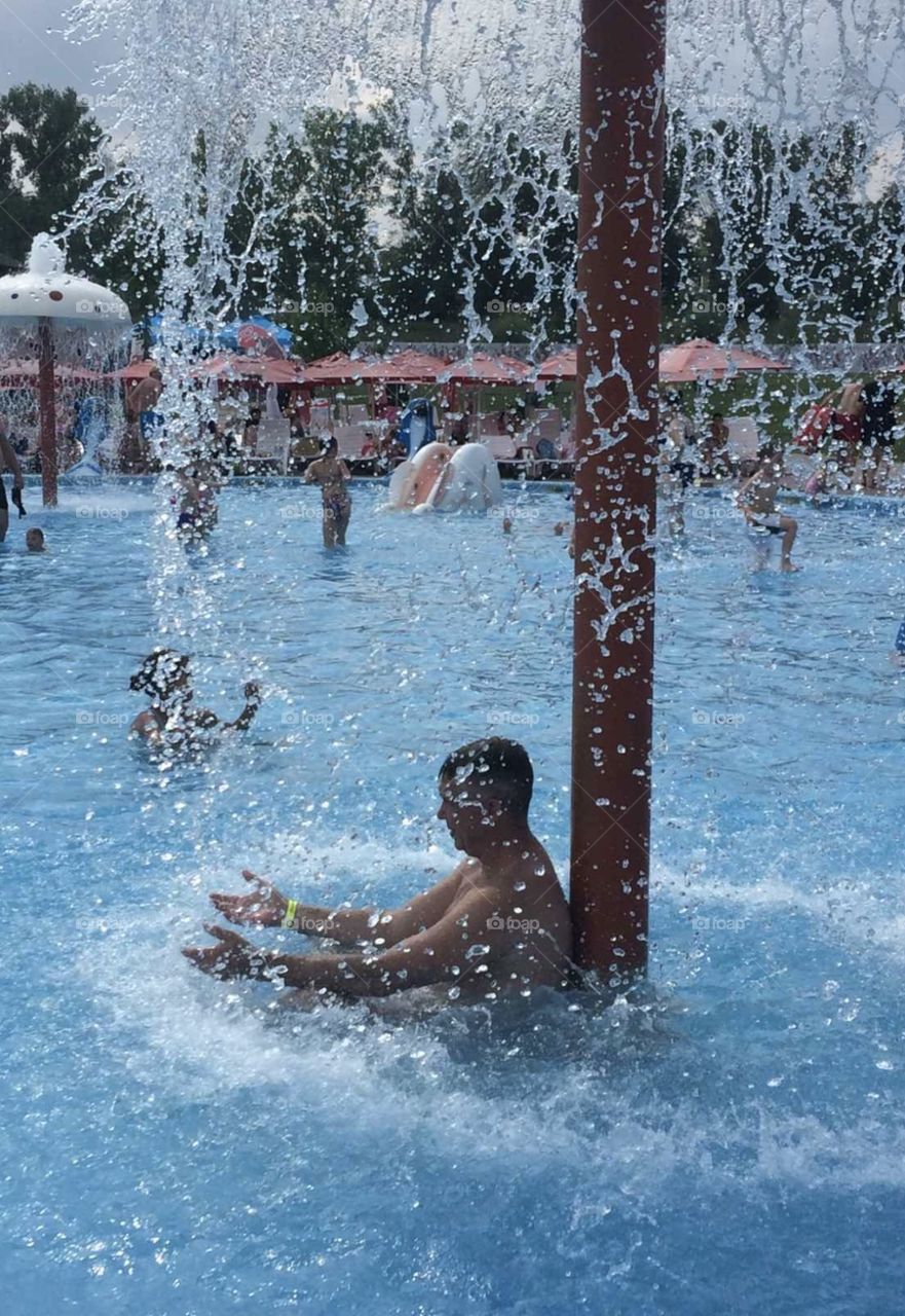 man under the fountain