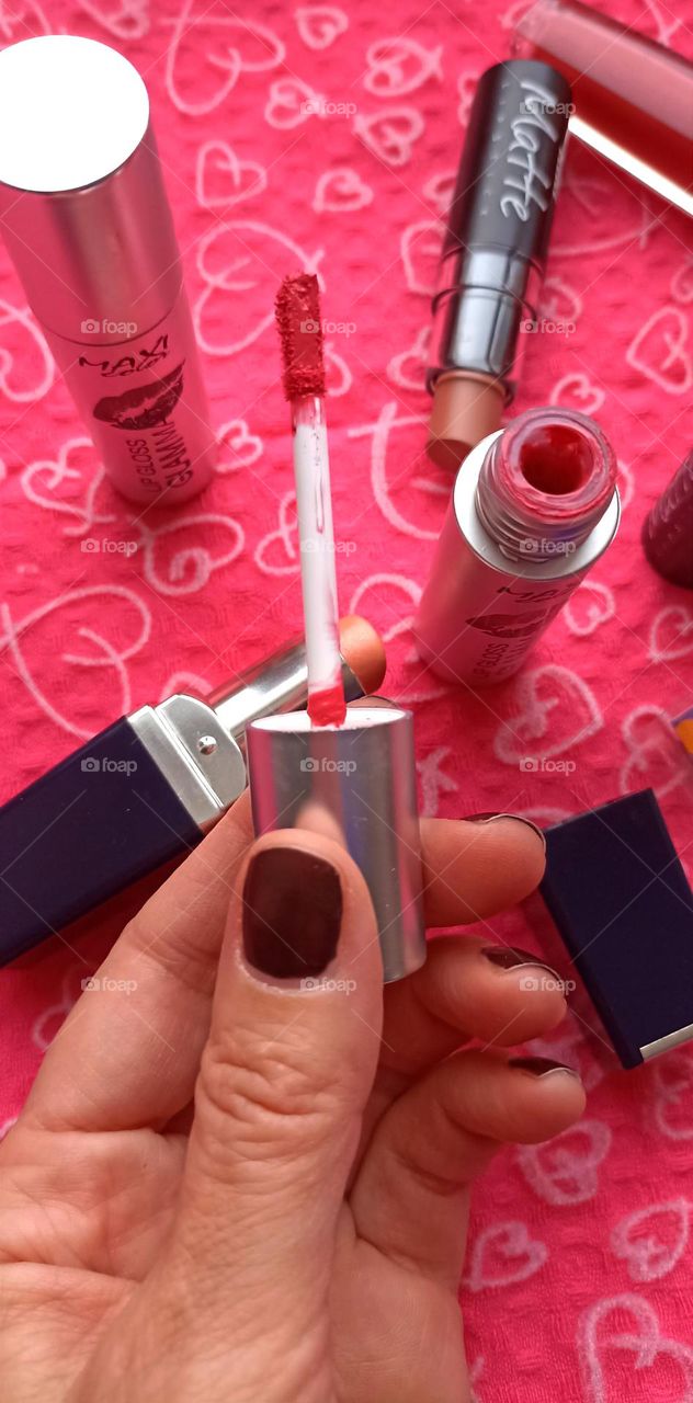 lipstick in the female hand beauty product love