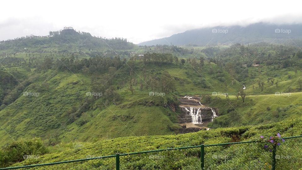 Beautiful waterfall surrounded by mountain