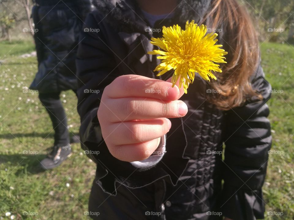 The love of your daughter who brings you a flower