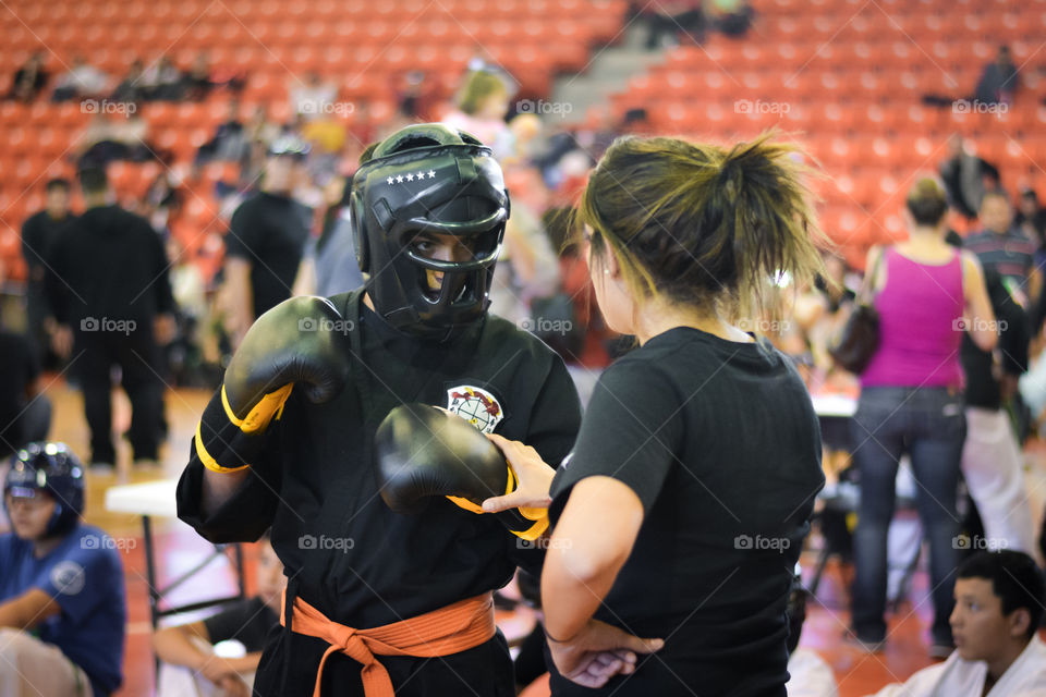 Fighter with his female trainer receiving instructions and motivation for the fight