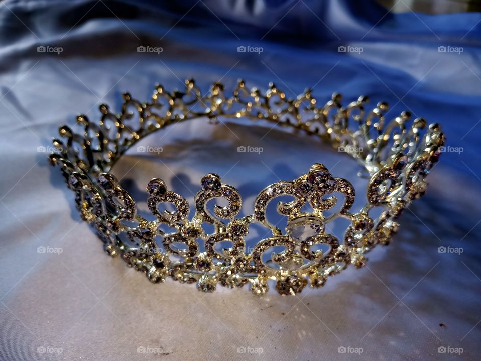 crown headdress with trinkets around it for a wedding