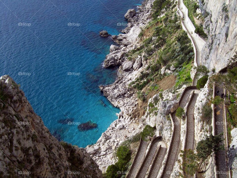 A long winding path down to the crystal clear waters below on the beautiful island of Capri