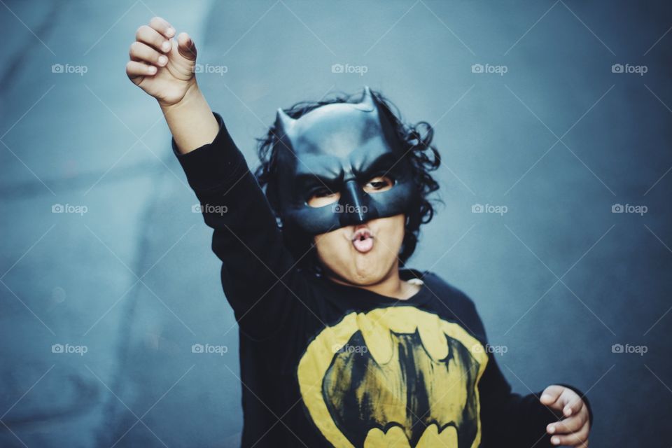 Portrait of boy wearing batman costume