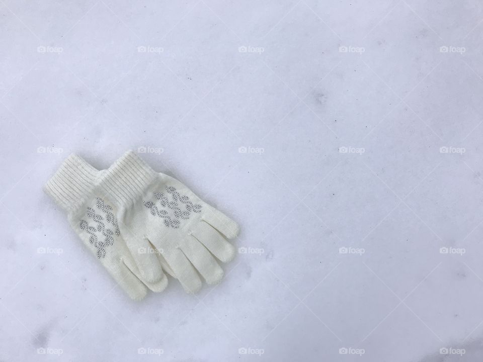 White gloves on the snow
