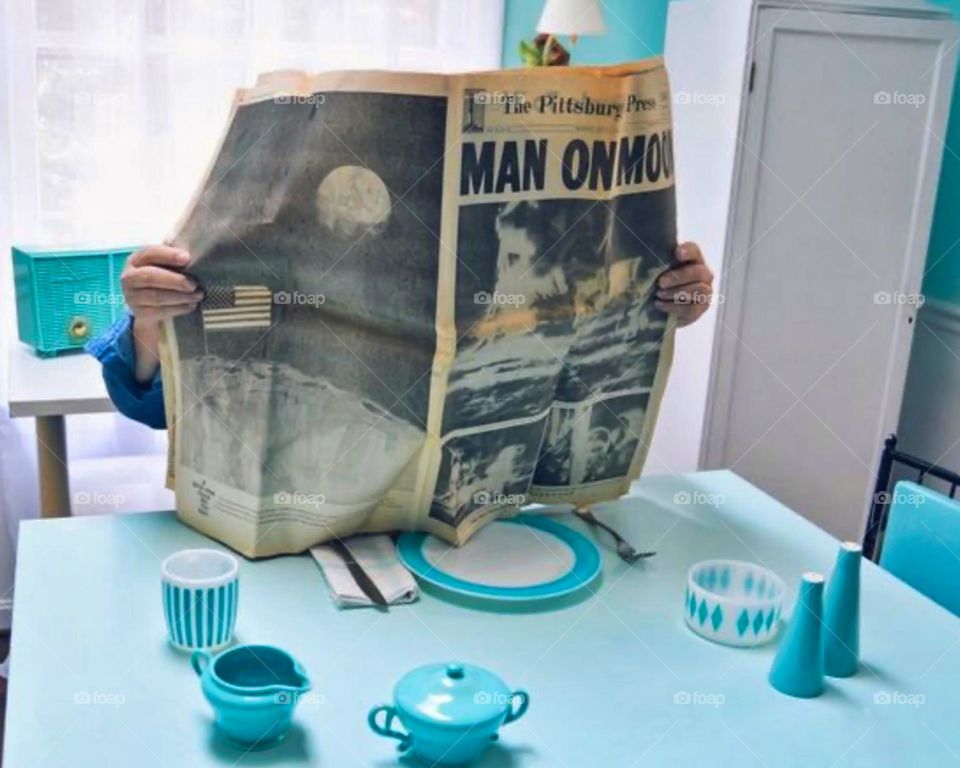 Man on the moon newspaper and vintage decor