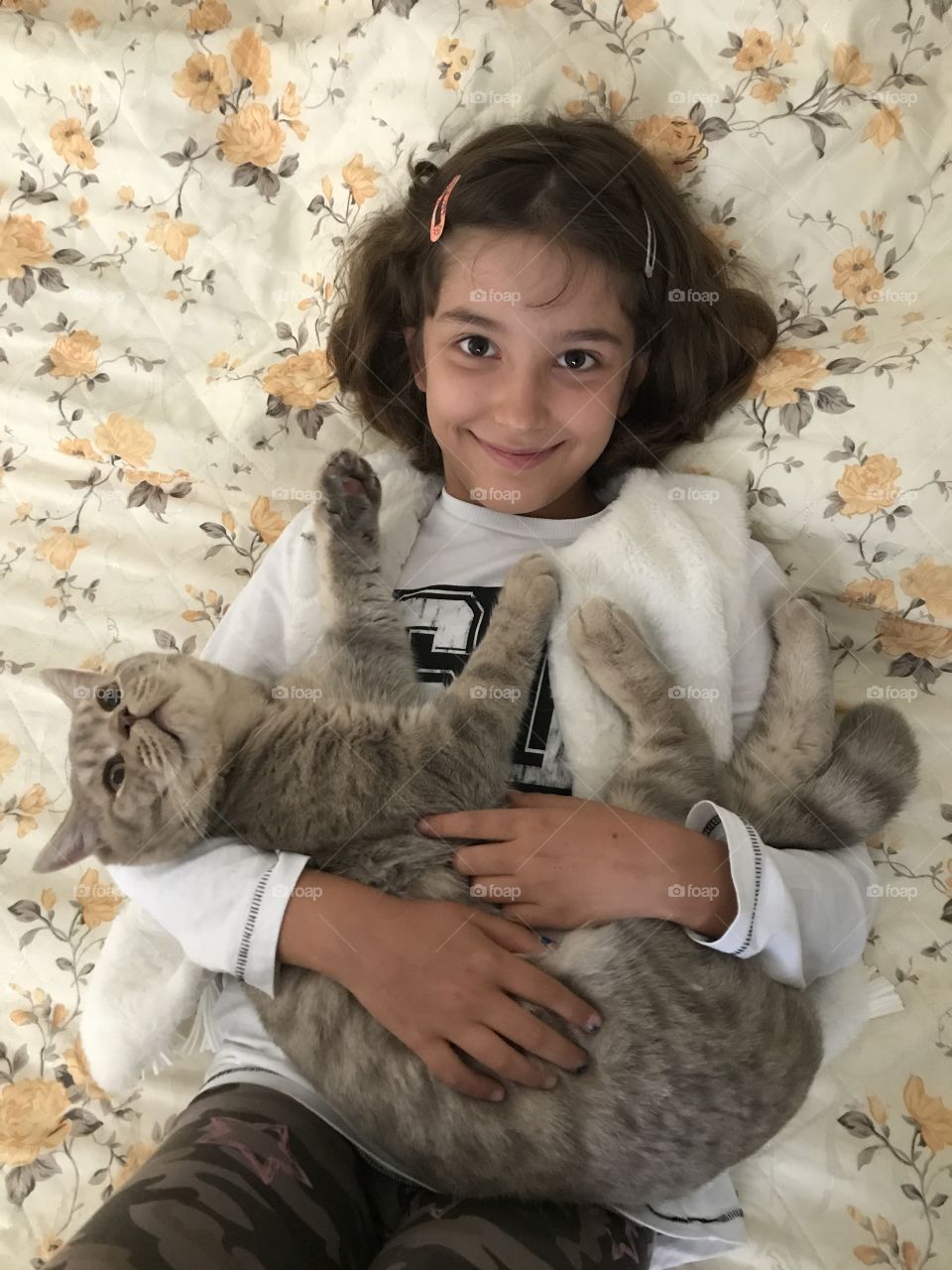 Young girl with her cat 