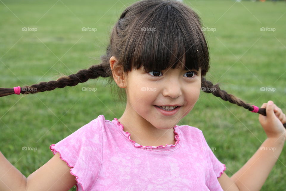 Portrait of a cute girl with braids