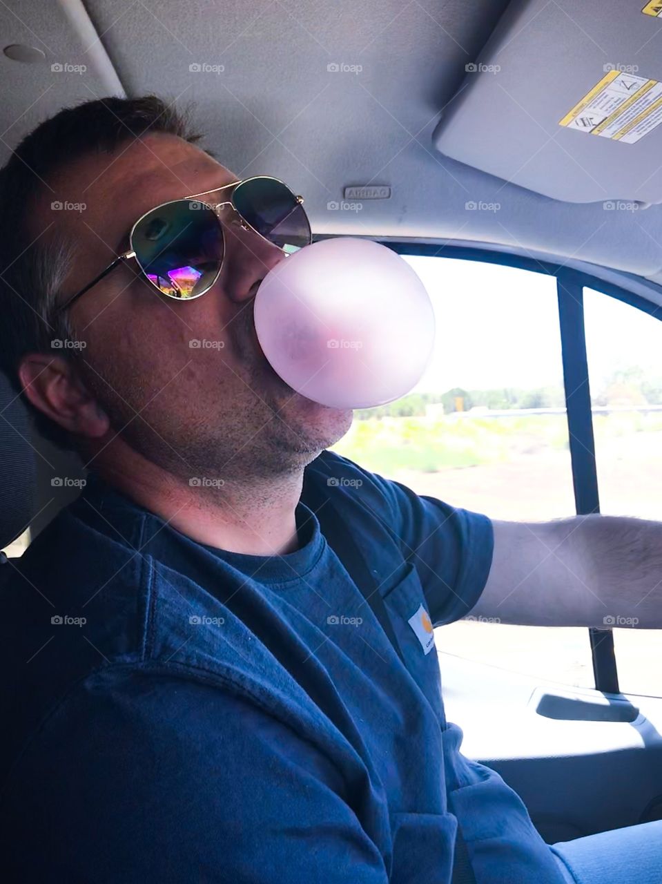   My dad blowing a bubble with Bubblicious  Bubblegum. He so cute:)