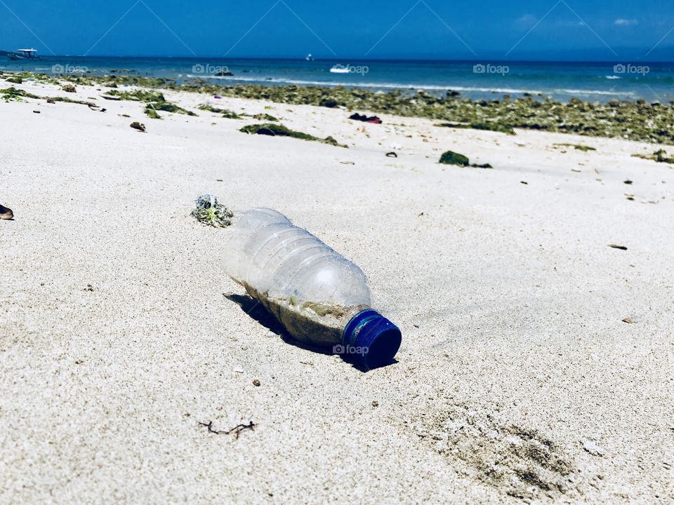 Plastic Bottle on a sandy beach