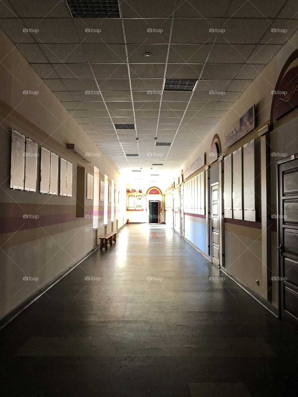 square ceiling of long corridor snd rectangle stand