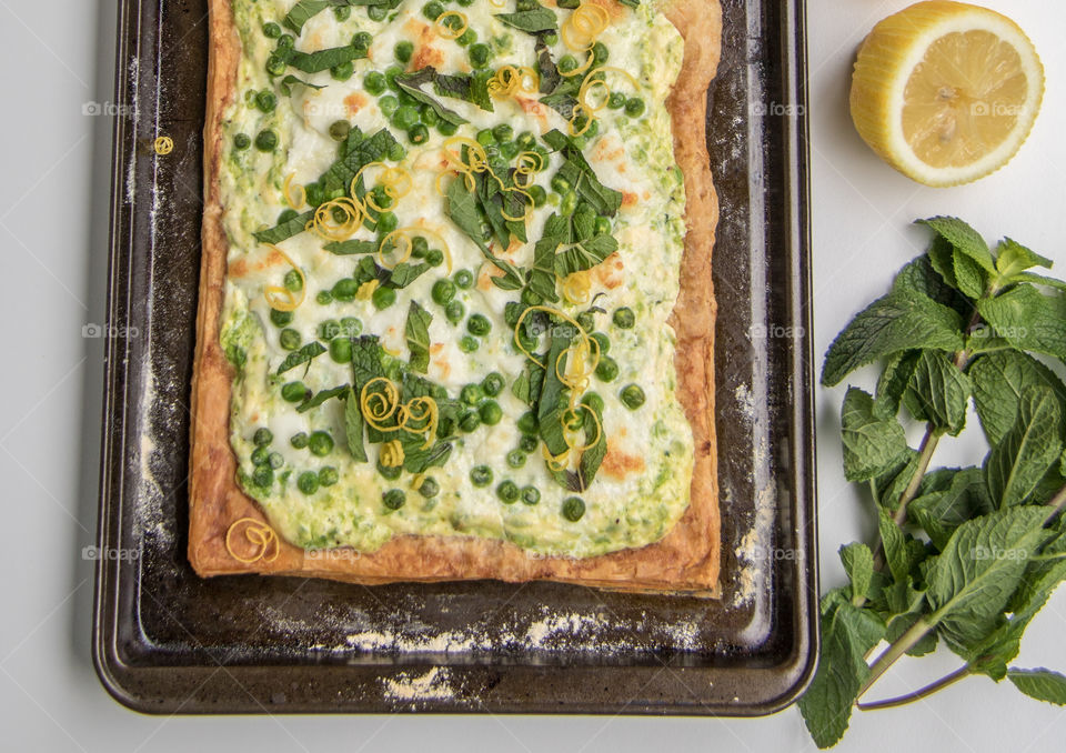 Lemon, pea and goat cheese puff pastry tart 