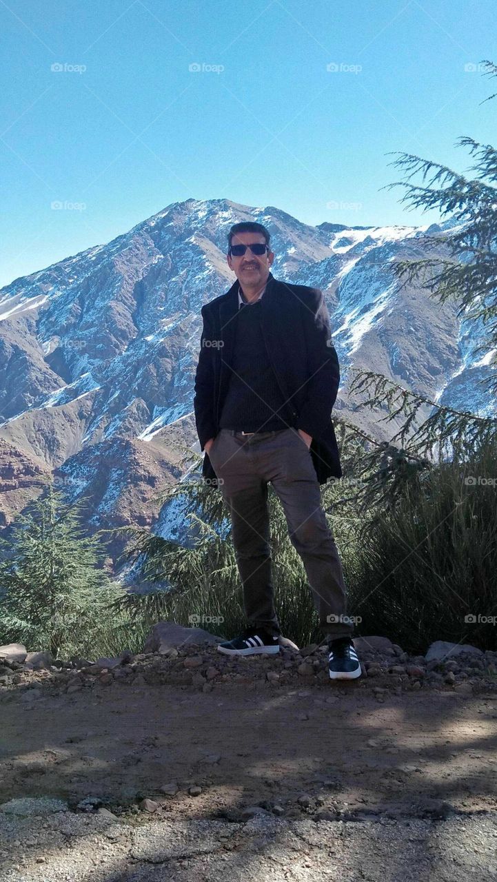 Im standing in nature near the highest mountain in morocco.