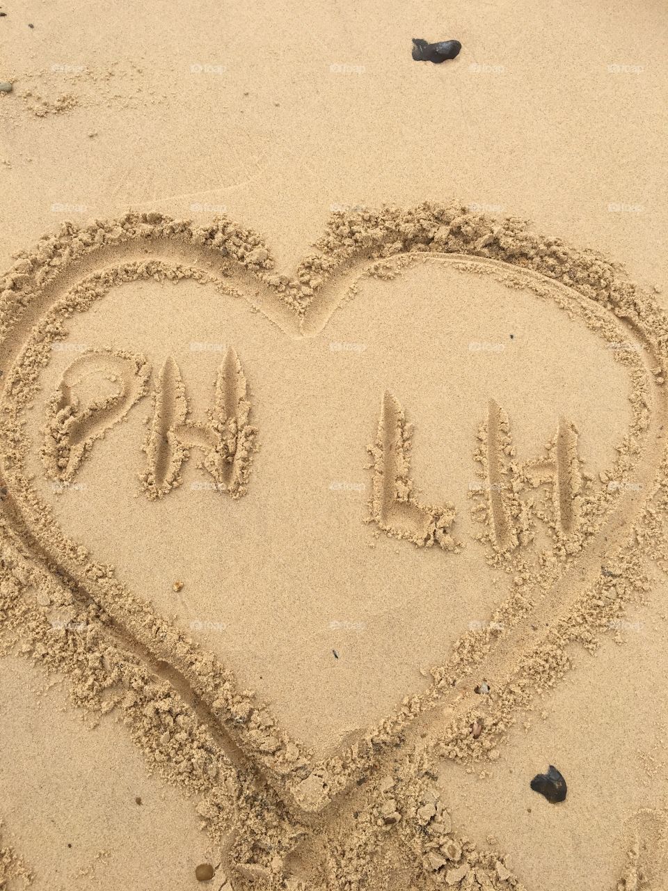 Love heart drawn in the sand 