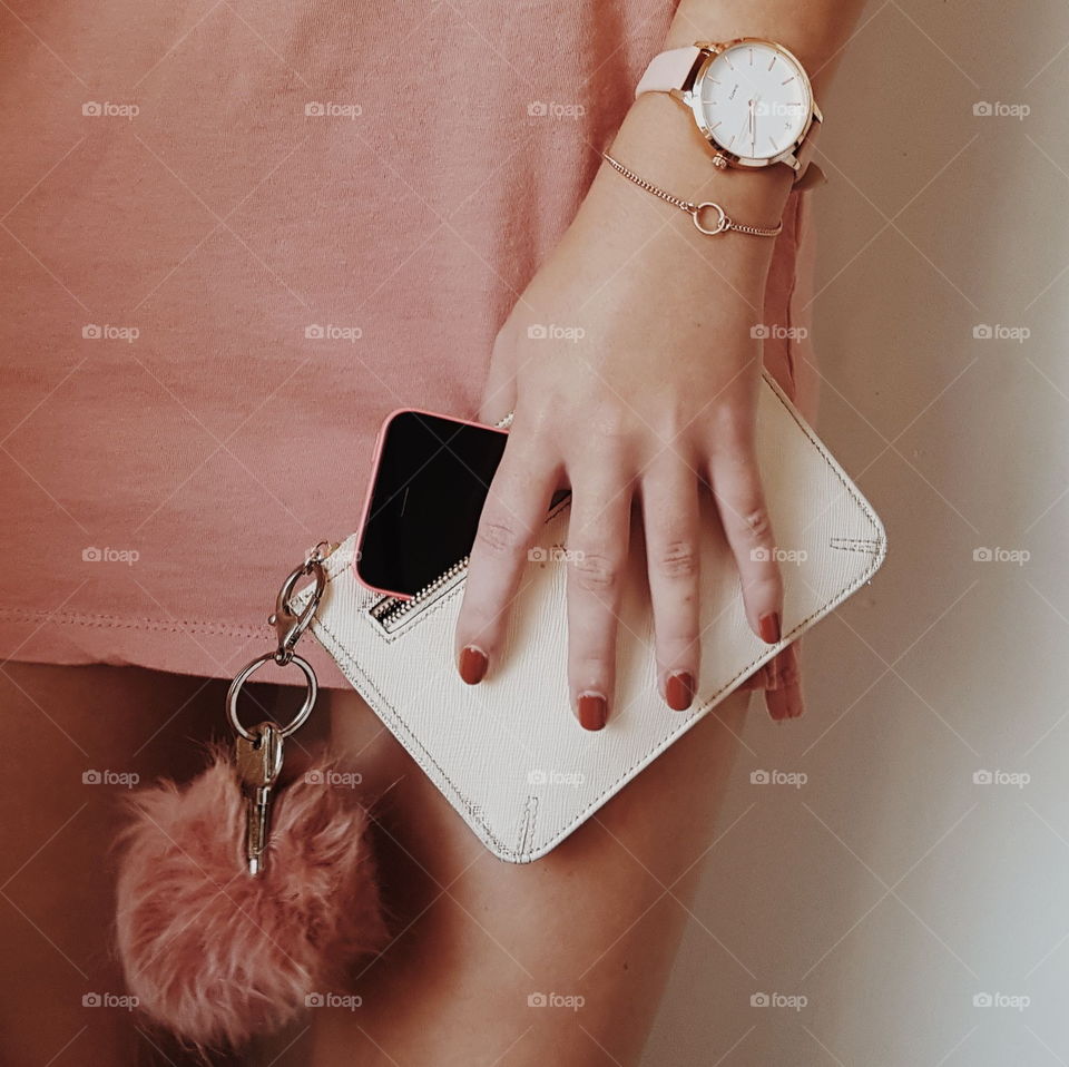 Holding everything you need in one hand: purse, keys, phone. Might as well make it match your outfit.