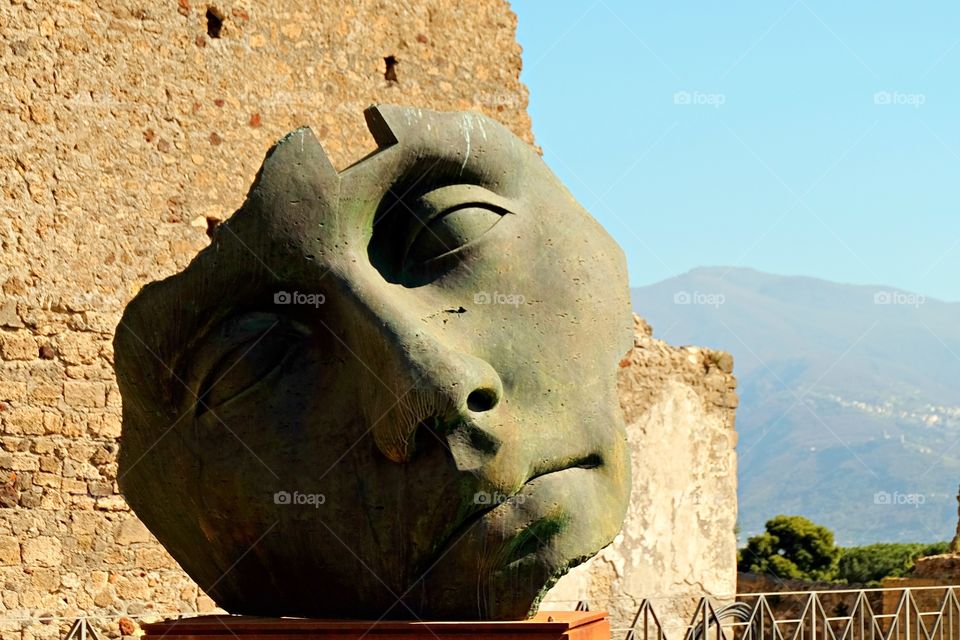 Over-size colossal bronze by Polish artist Igor Mitoraj displayed in Pompei, Italy.