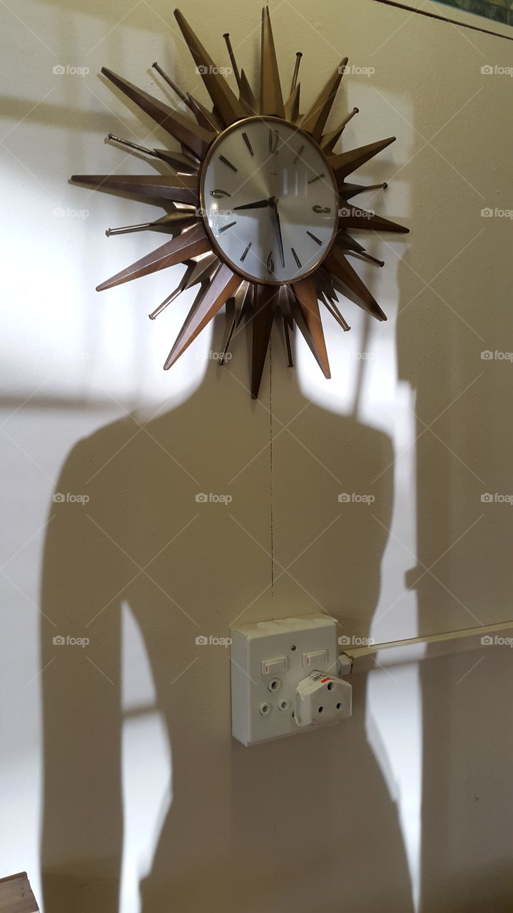this mannequin in our office was in the perfect spot to line up with a clock on the wall and create a rather abstract silhouette as the morning sun came up