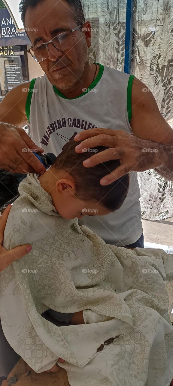 Boy falls asleep while cutting his hair