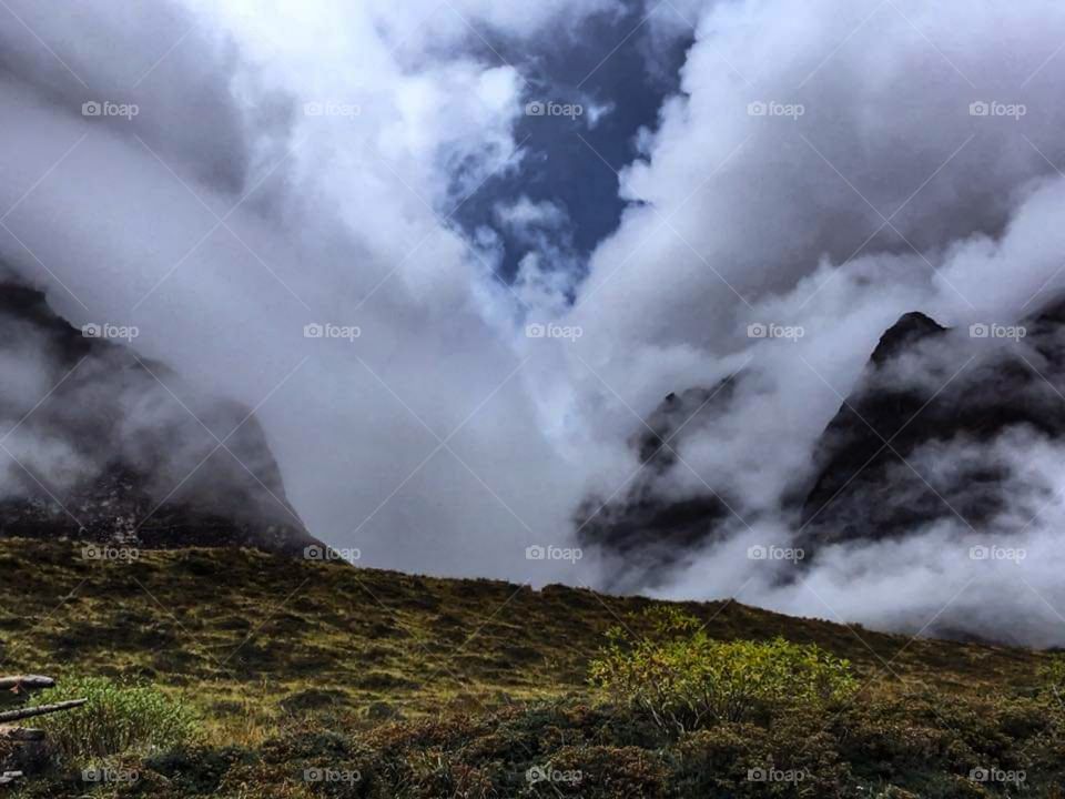 The clouds quickly creep up the valley on the way to Mt. Dhaulagiri. Taken during the Dhaulagiri Circuit Trek in Nepal.