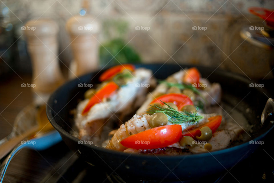 Dish with Sea bass fried with vegetables 