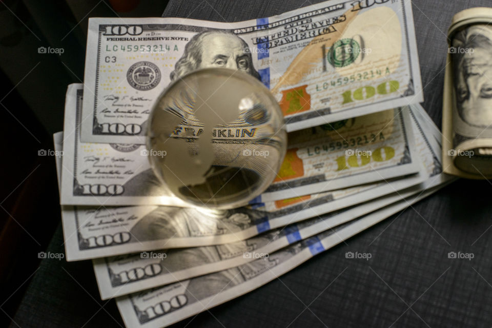 transparent globe on dollars