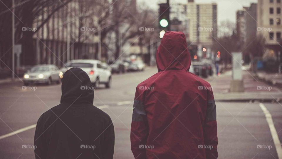 Two Males Walking Away From Camera in Urban City Streets