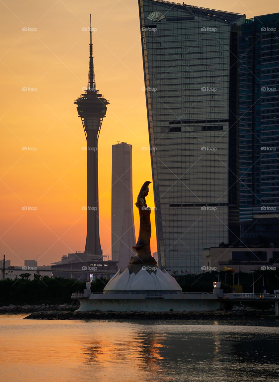 Sunset Behind the City Tower and Structures. 