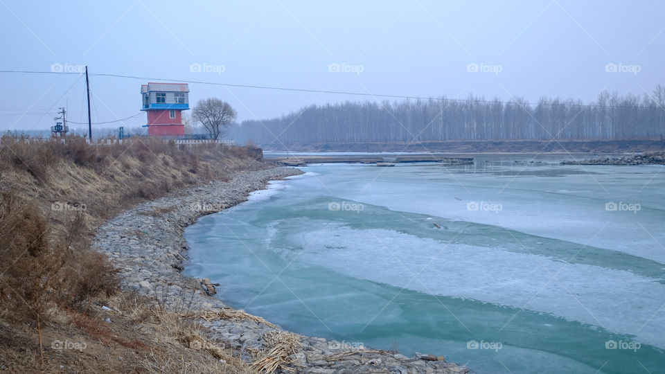 The ice on the river is melting