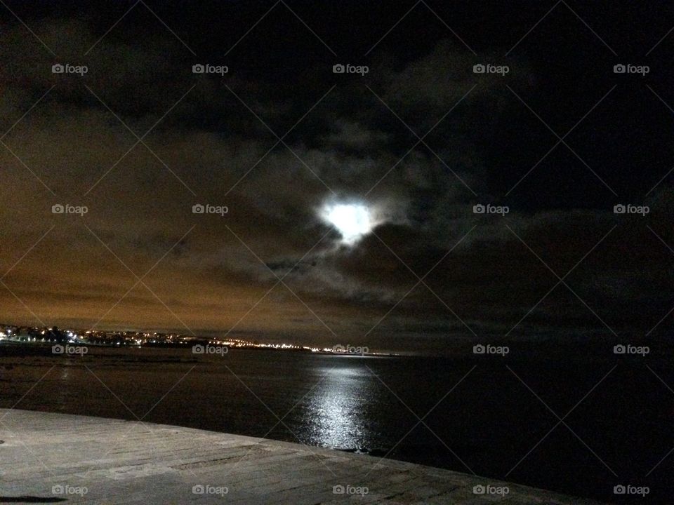 Beautiful full moon reflected in the Ocean at night